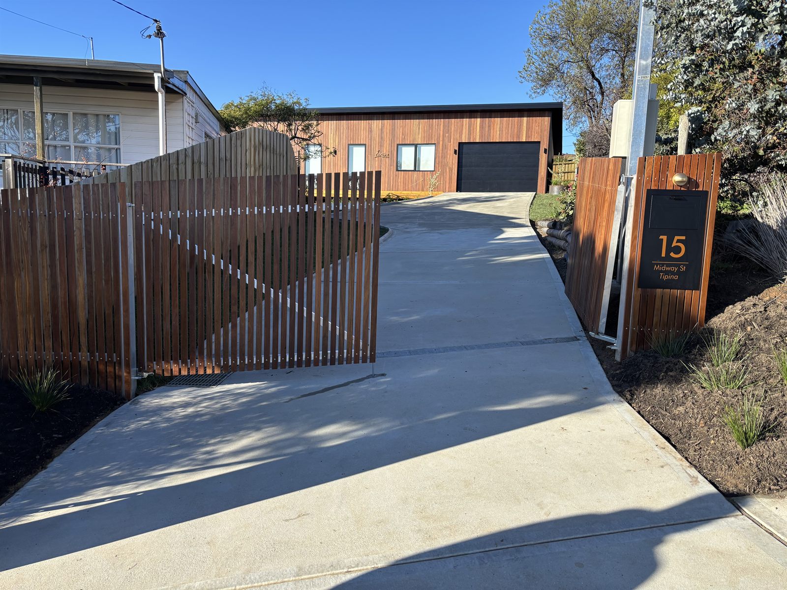 Finished timber-batten sliding driveway gate